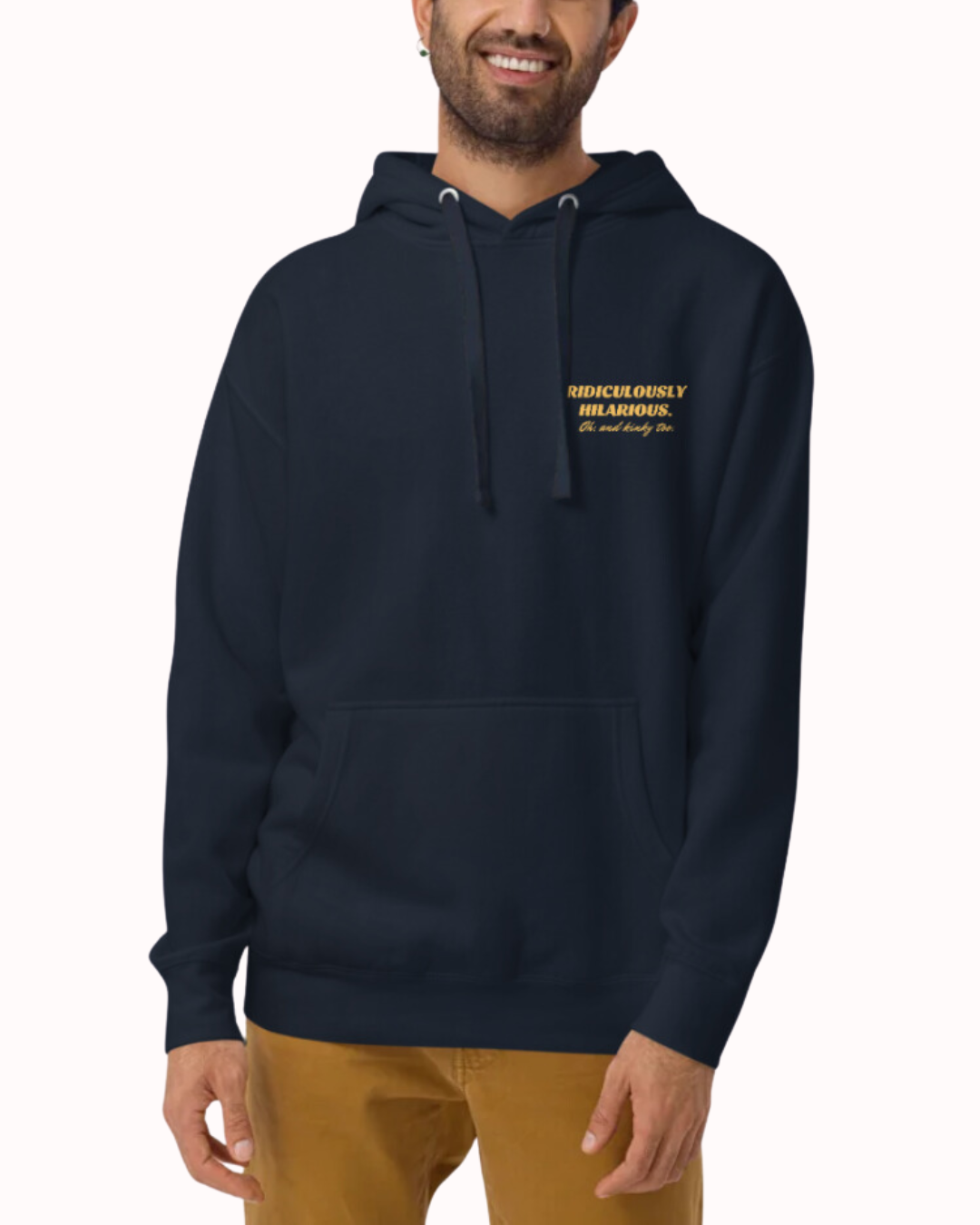 Front view of a navy blazer hoodie worn by a smiling man, featuring the phrase 'Ridiculously hilarious. Oh, and kinky too' on the chest and back. Perfect for fans of funny merchandise, bold humor, and witty sarcasm.