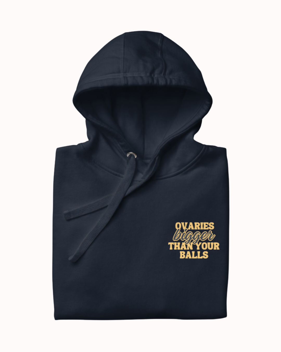 Folded navy blazer hoodie featuring the ironic phrase 'Ovaries bigger than your balls'. Perfect for fans of funny merchandise, bold humor, and witty sarcasm.