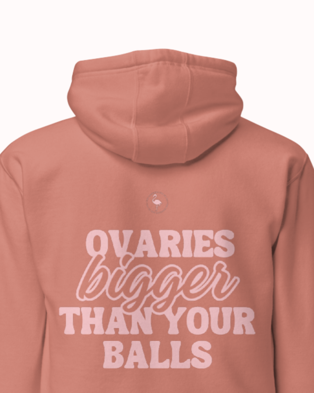 Back view of a dusty rose hoodie featuring the phrase 'Ovaries bigger than your balls' on the back. Perfect for fans of funny merchandise, bold humor, and witty sarcasm.