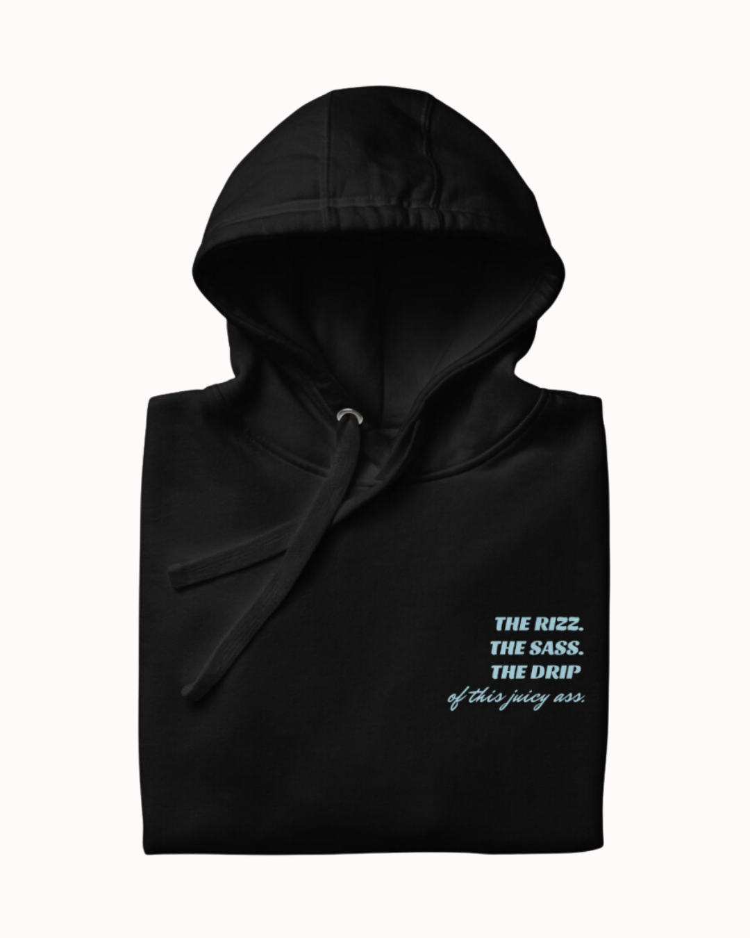 Folded black hoodie featuring the ironic phrase 'The Rizz. The Sass. The Drip of this Juicy Ass'. Perfect for fans of funny merchandise, bold humor, and witty sarcasm.