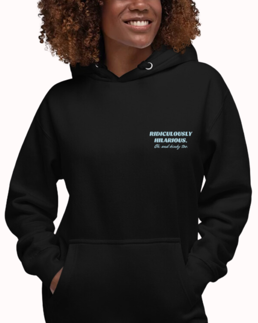 Front view of a black hoodie worn by a smiling woman, featuring the phrase 'Ridiculously hilarious. Oh, and kinky too' on the chest and back. Perfect for fans of funny merchandise, bold humor, and witty sarcasm.
