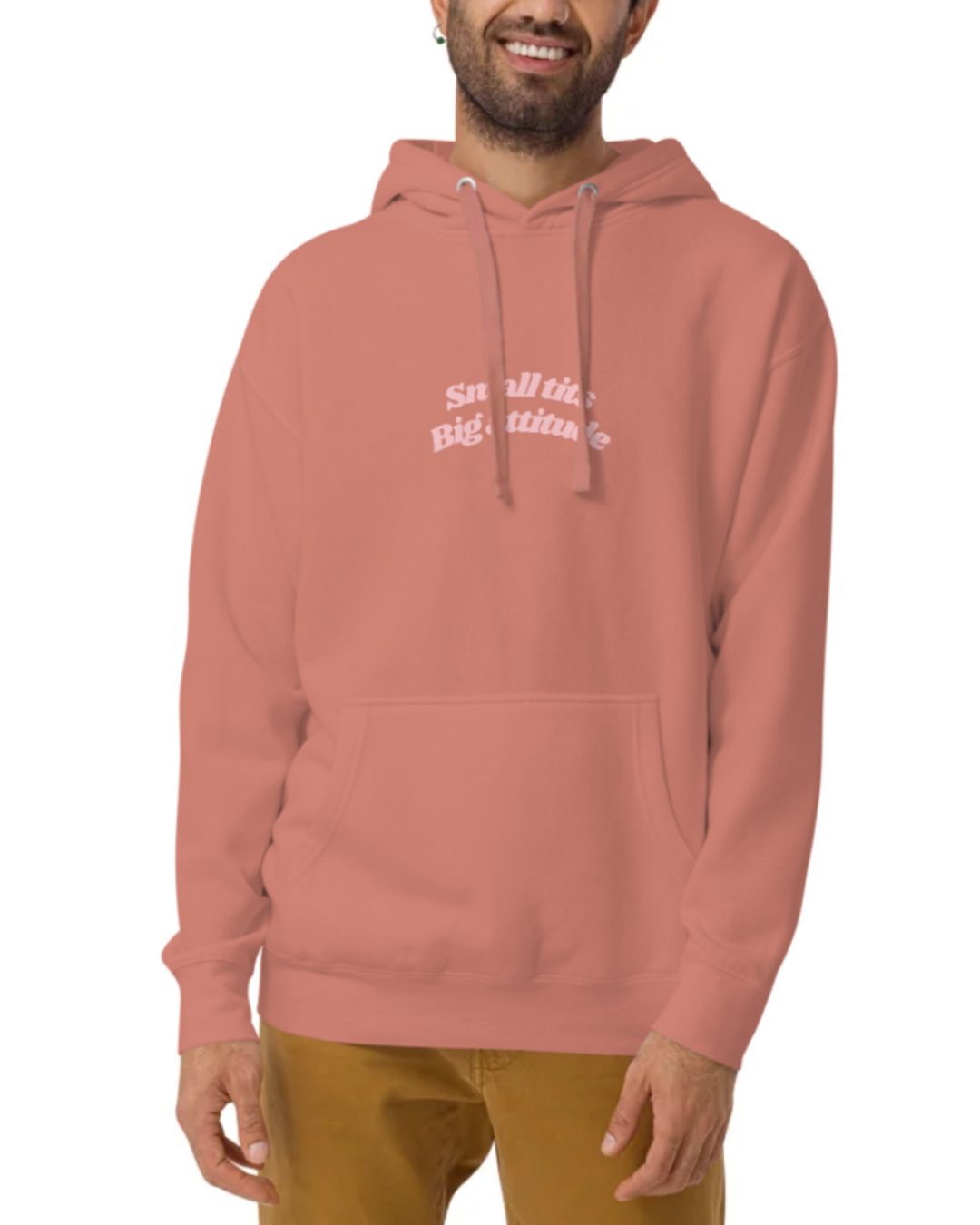 Front view of a Dusty Rose hoodie worn by a smiling man, featuring the phrase "Small tits. Big attitude" on the chest and back. Perfect for fans of funny merchandise, bold humor, and witty sarcasm.