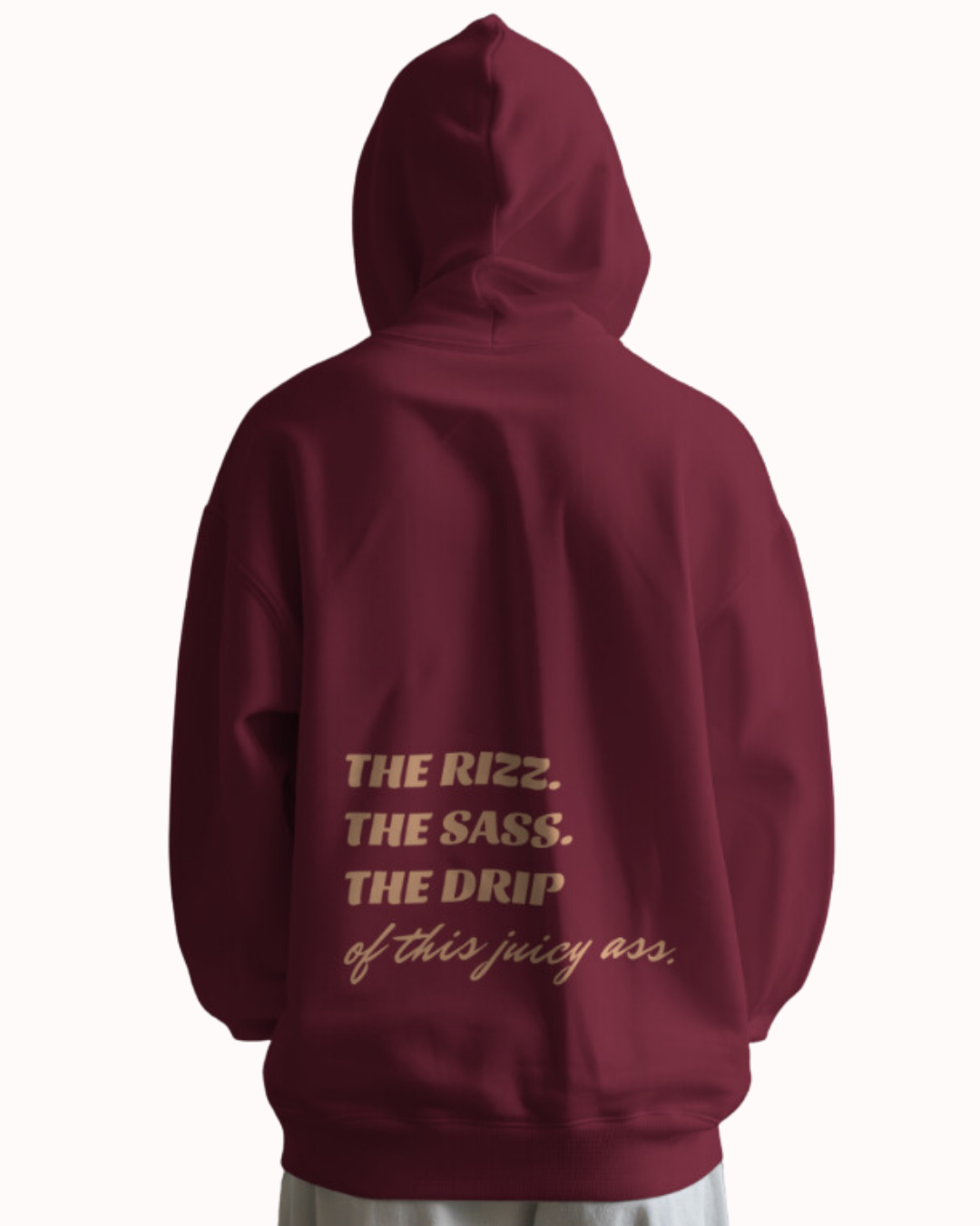 Back view of a maroon hoodie featuring the phrase 'The Rizz. The Sass. The Drip of this Juicy Ass' on the back. Perfect for fans of funny merchandise, bold humor, and witty sarcasm.