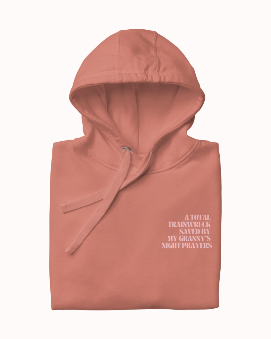 Back view of a Dusty Rose hoodie featuring the phrase "A total trainwreck saved my granny's night prayers" on the back. Perfect for fans of funny merchandise, bold humor, and witty sarcasm.