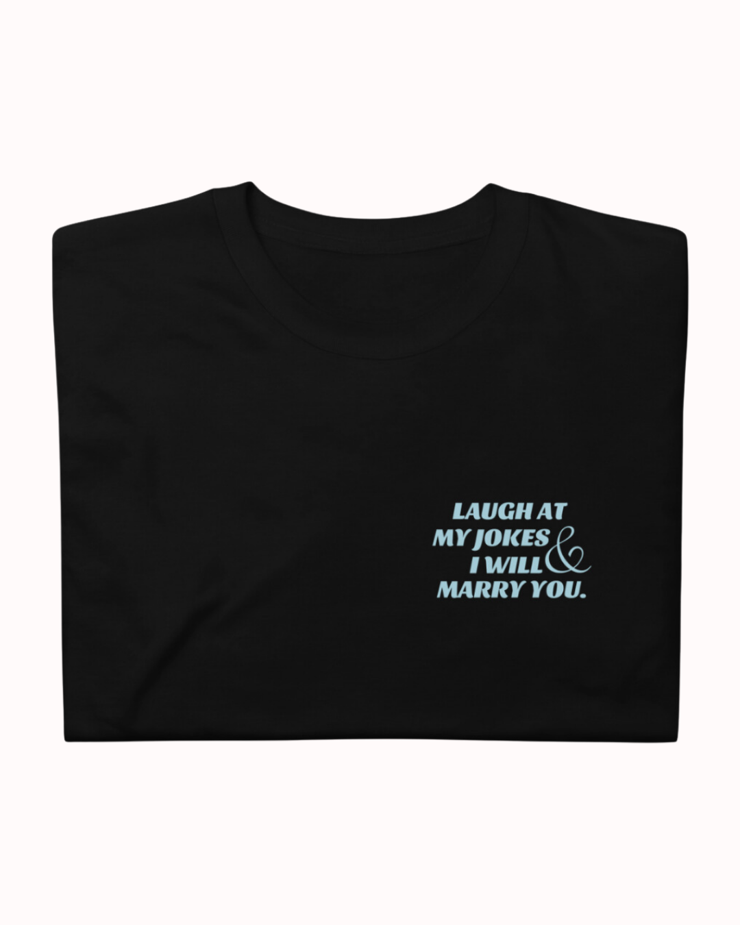 Folded black T-Shirt featuring the ironic phrase 'I'm so funny my life became a joke'. Perfect for fans of funny merchandise, bold humor, and witty sarcasm.