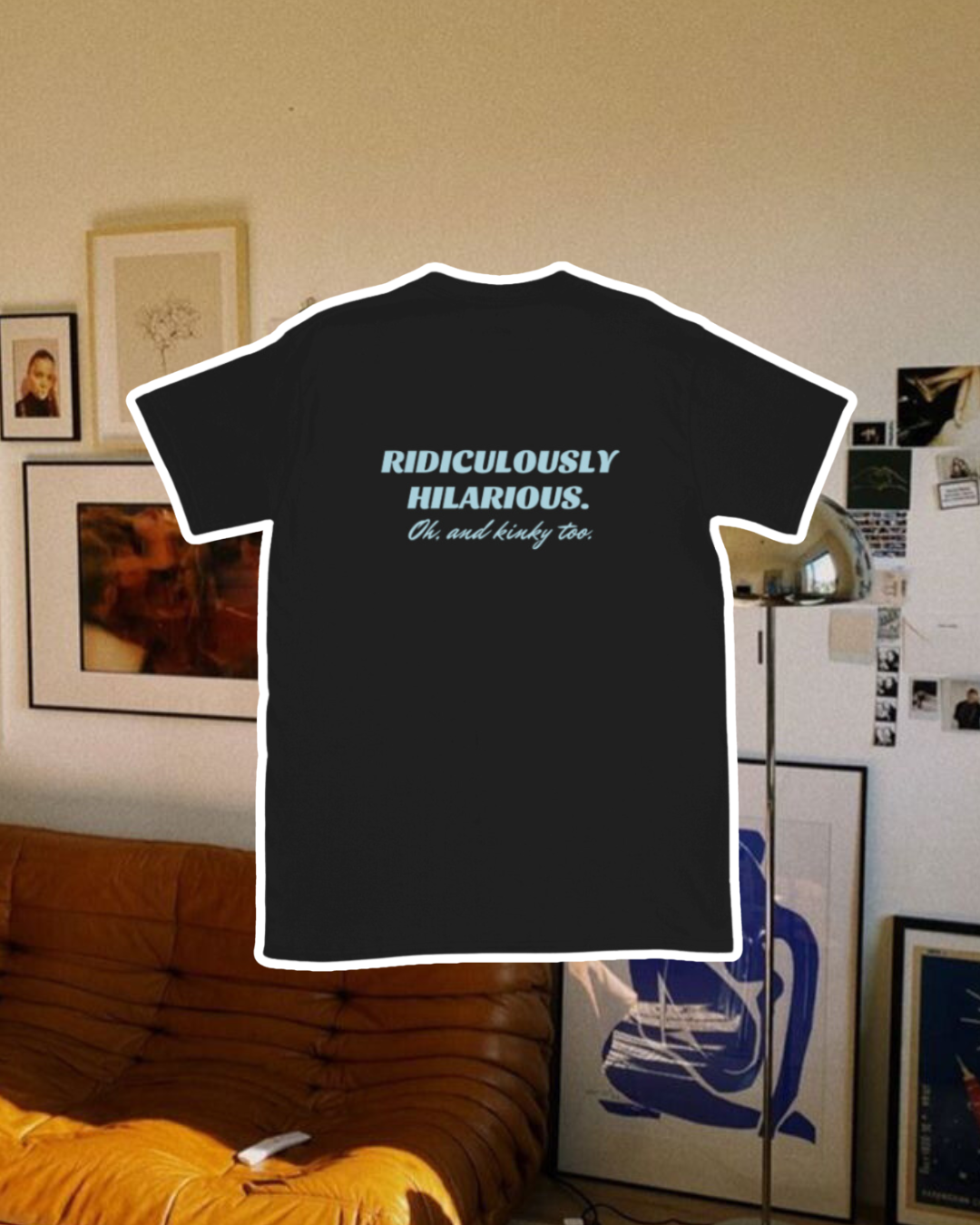 Black T-Shirt with the phrase 'Ridiculously hilarious. Oh, and kinky too' on the back, displayed against a vibrant living room with cozy elements and colorful frames. A playful and bold design for fans of funny merchandise and sarcasm.