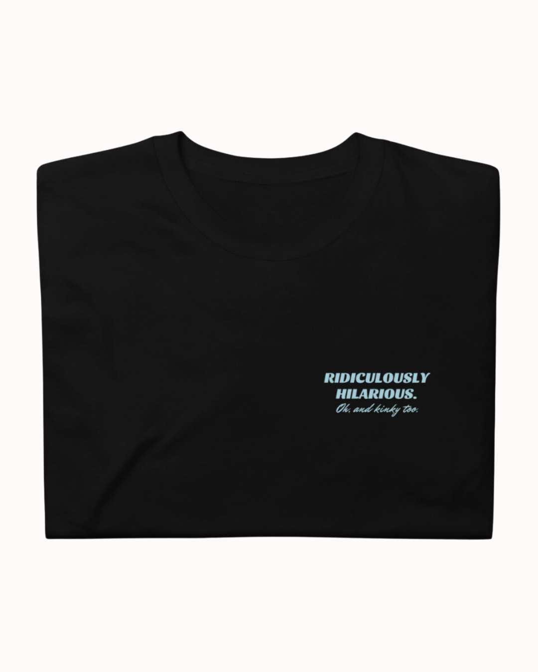 Folded black T-Shirt featuring the ironic phrase 'Ridiculously hilarious. Oh, and kinky too'. Perfect for fans of funny merchandise, bold humor, and witty sarcasm.