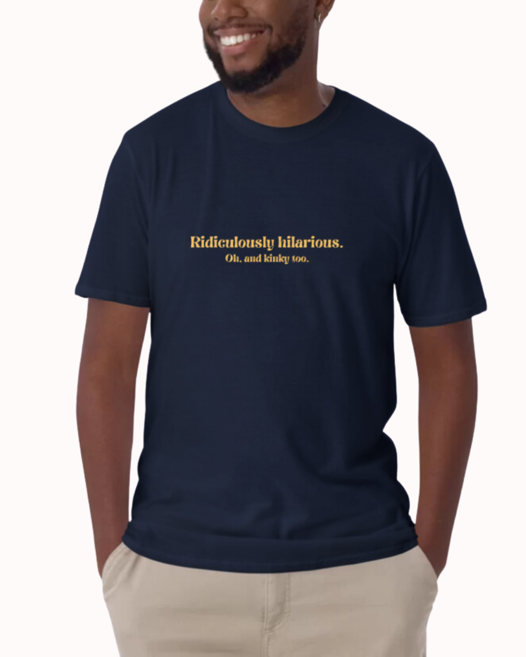Front view of a navy T-Shirt worn by a smiling man, featuring the phrase 'Ridiculously hilarious. Oh, and kinky too' on the chest. Perfect for fans of funny merchandise, bold humor, and witty sarcasm.