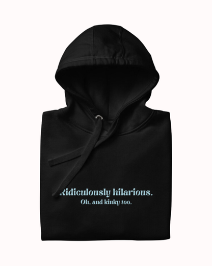 Folded black hoodie featuring the ironic phrase 'Ridiculously hilarious. Oh, and kinky too'. Perfect for fans of funny merchandise, bold humor, and witty sarcasm.