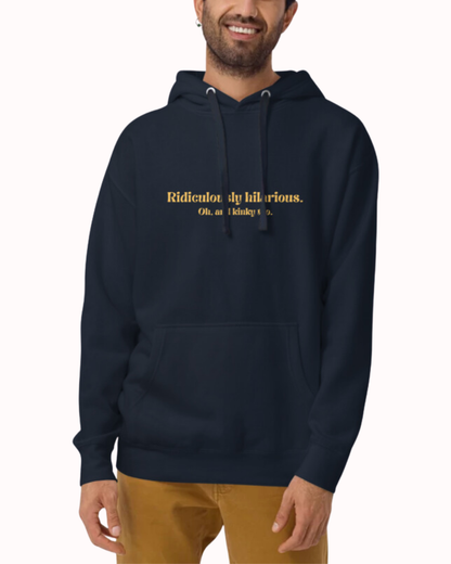 Front view of a navy blazer hoodie worn by a smiling man, featuring the phrase 'Ridiculously hilarious. Oh, and kinky too' on the chest. Perfect for fans of funny merchandise, bold humor, and witty sarcasm.