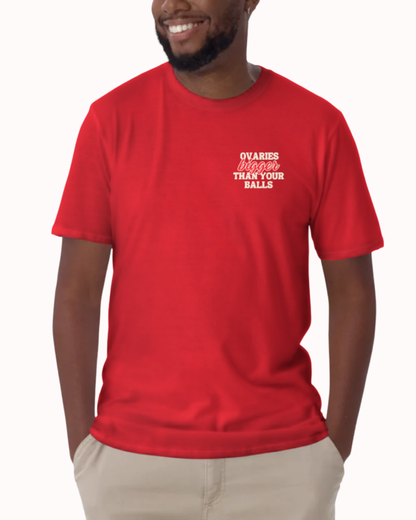 Front view of a Red t-shirt worn by a smiling man, featuring the phrase "Ovaries bigger than your balls" on the chest and back. Perfect for fans of funny merchandise, bold humor, and witty sarcasm.