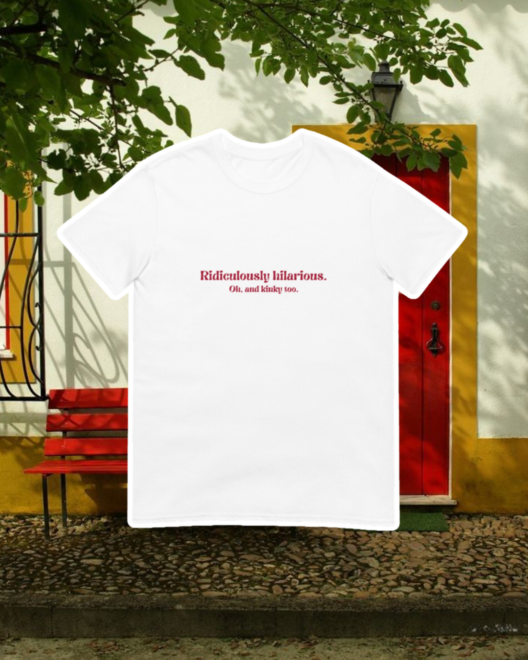 White T-Shirt with the phrase 'Ridiculously hilarious. Oh, and kinky too' on the chest, displayed against an inviting space, perfect for relaxation or gathering with friends. A playful and bold design for fans of funny merchandise and sarcasm. 