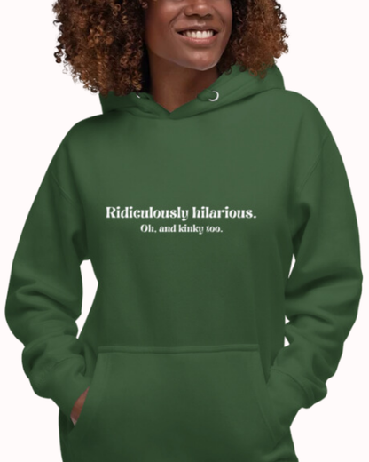 Front view of a forest green hoodie worn by a smiling woman, featuring the phrase 'Ridiculously hilarious. Oh, and kinky too' on the chest. Perfect for fans of funny merchandise, bold humor, and witty sarcasm.