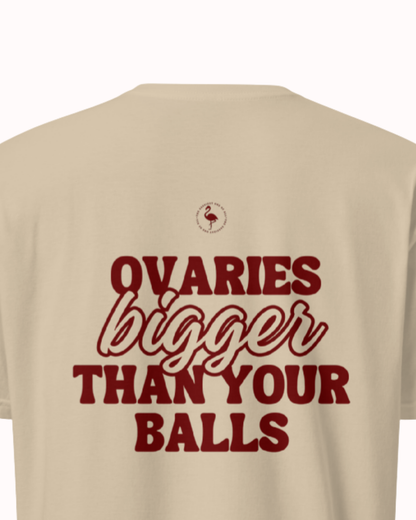 Back view of a Sand t-shirt featuring the phrase "Ovaries bigger than your balls" on the back. Perfect for fans of funny merchandise, bold humor, and witty sarcasm.