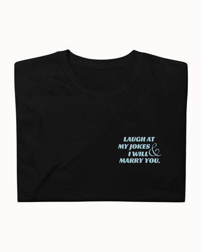 Folded black T-Shirt featuring the ironic phrase 'I'm so funny my life became a joke'. Perfect for fans of funny merchandise, bold humor, and witty sarcasm. 