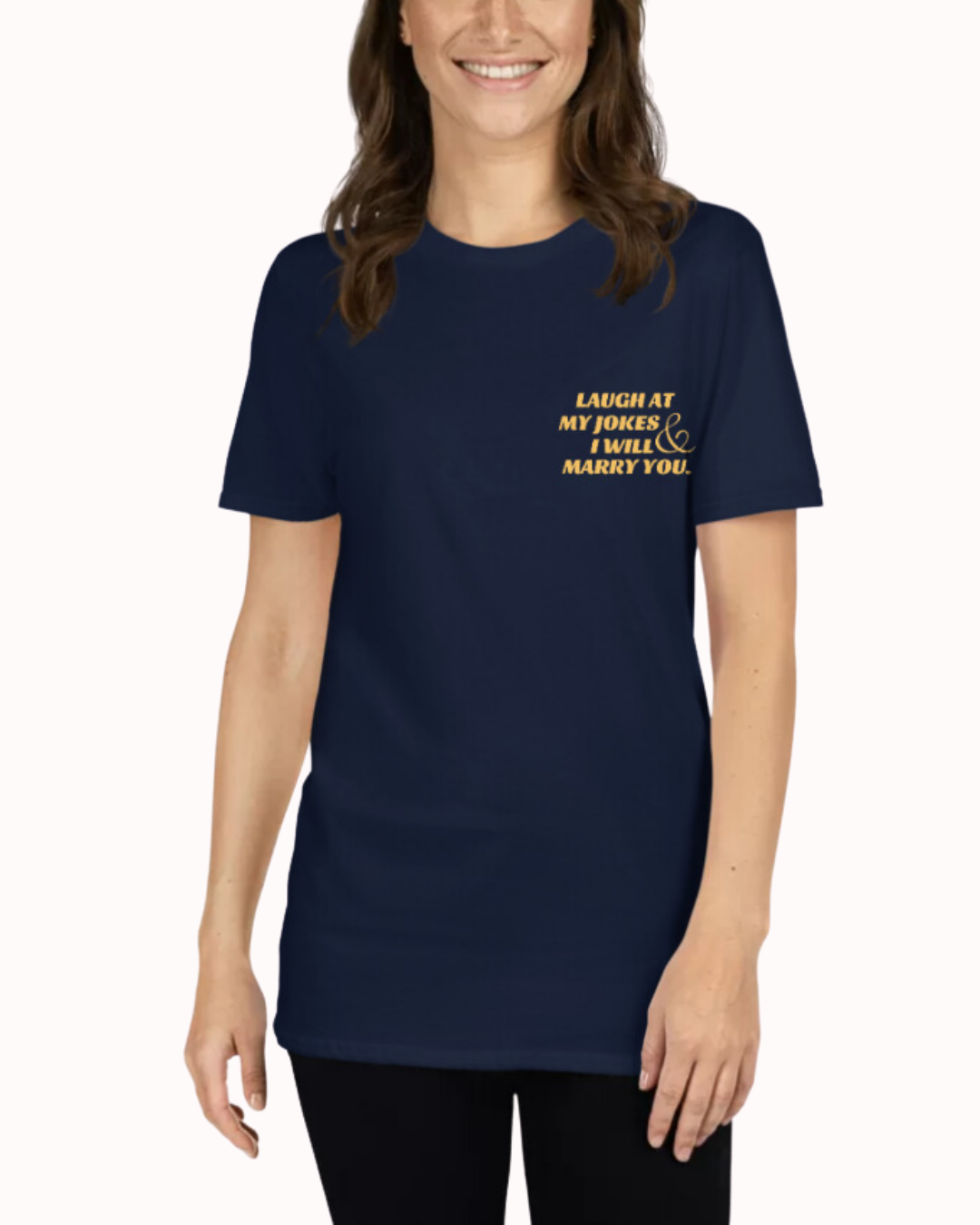 Front view of a navy T-Shirt worn by a smiling woman, featuring the phrase 'Laugh at my jokes and I will marry you'' on the chest and back. Perfect for fans of funny merchandise, bold humor, and witty sarcasm.