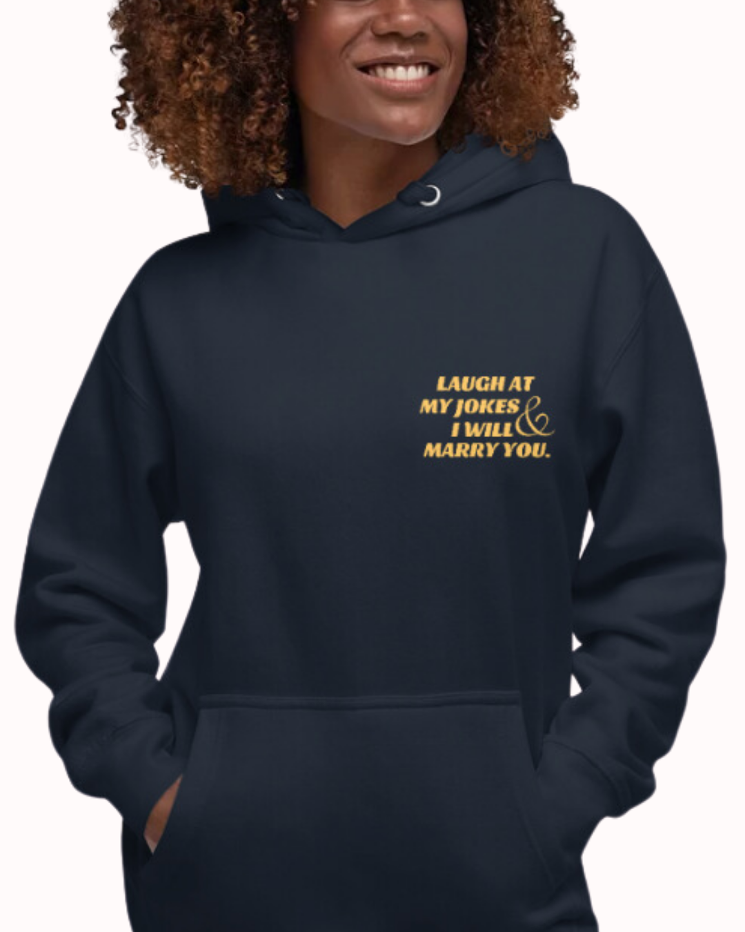 Front view of a navy blazer hoodie worn by a smiling woman, featuring the phrase 'Laugh at my jokes and I will marry you' on the chest and back. Perfect for fans of funny merchandise, bold humor, and witty sarcasm.