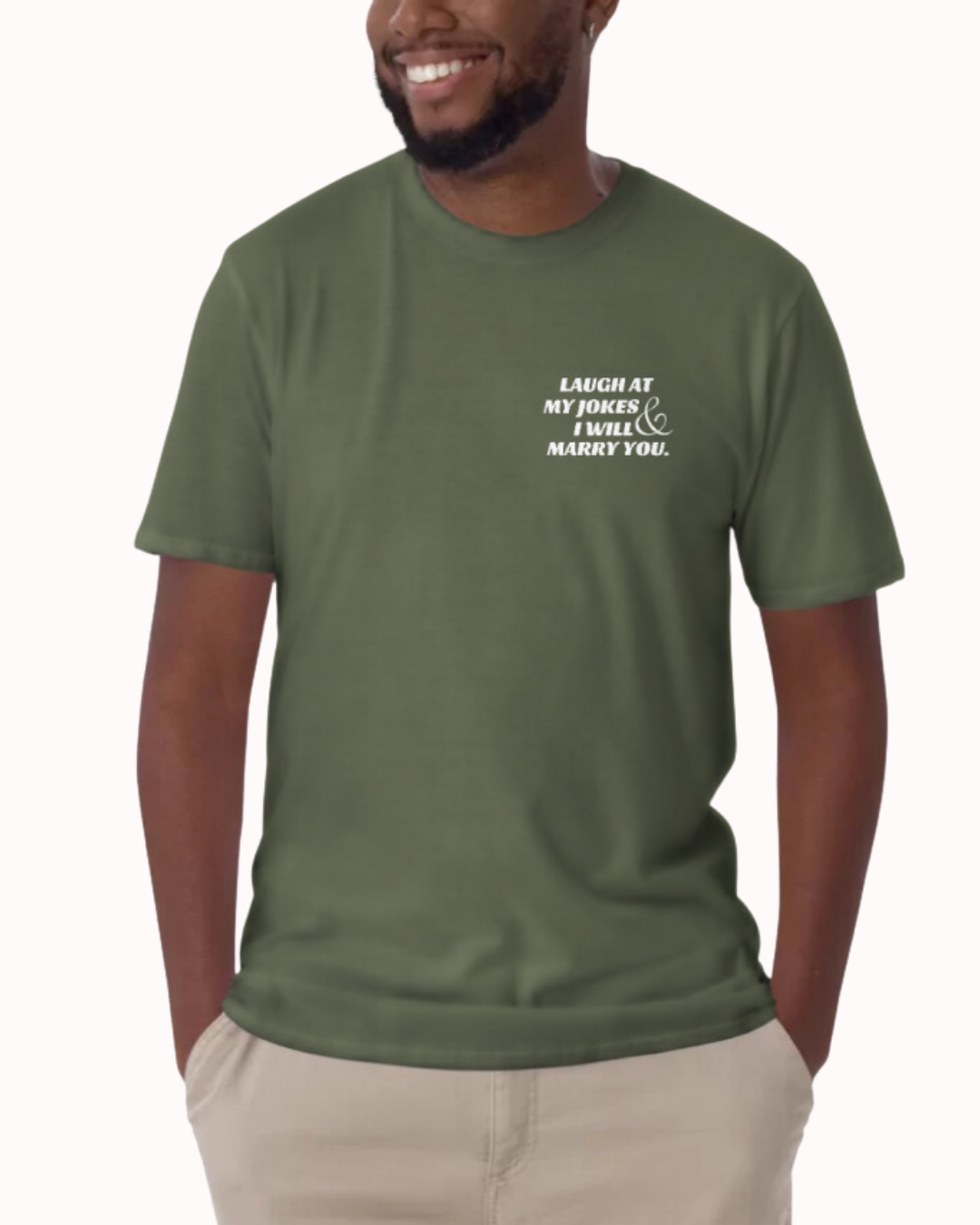 Front view of a military green T-Shirt worn by a smiling man, featuring the 'Laugh at my jokes and I will marry you' on the chest and back. Perfect for fans of funny merchandise, bold humor, and witty sarcasm. 