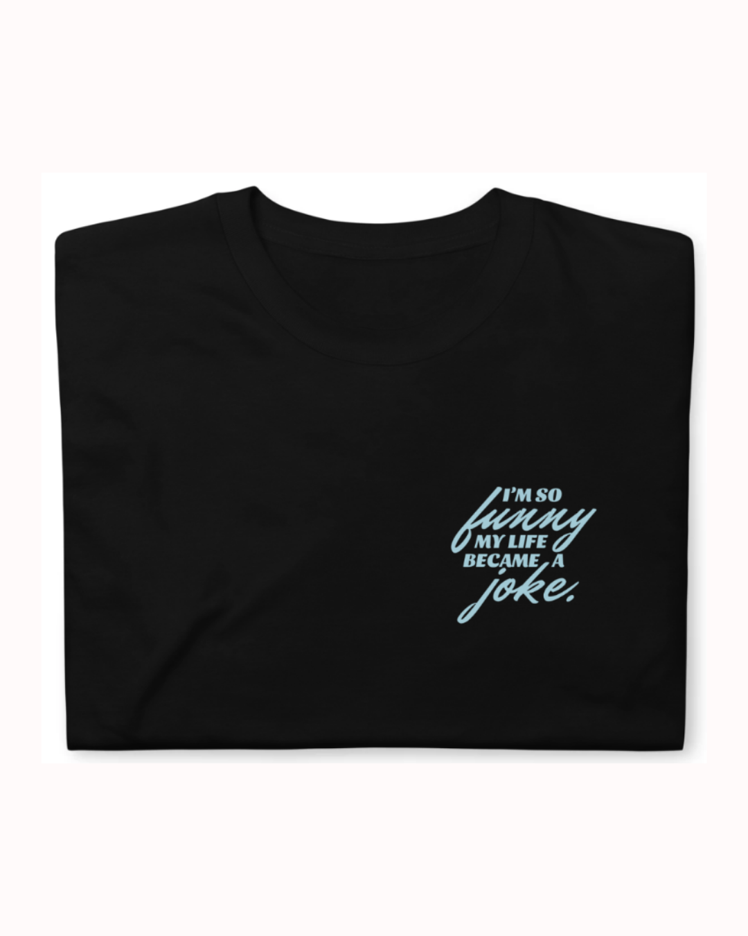 Folded black T-Shirt featuring the ironic phrase 'I'm so funny my life became a joke'. Perfect for fans of funny merchandise, bold humor, and witty sarcasm. 