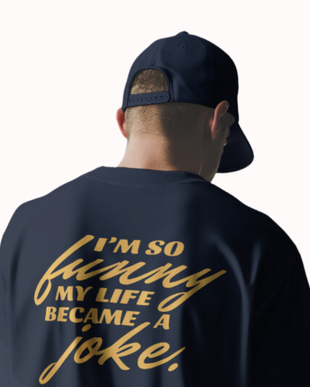 Back view of a navy T-Shirt featuring the phrase 'I'm so funny my life became a joke' on the back. Perfect for fans of funny merchandise, bold humor, and witty sarcasm.