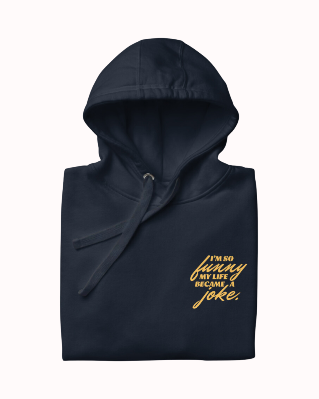 Folded navy blazer hoodie featuring the ironic phrase 'I'm so funny my life became a joke'. Perfect for fans of funny merchandise, bold humor, and witty sarcasm.