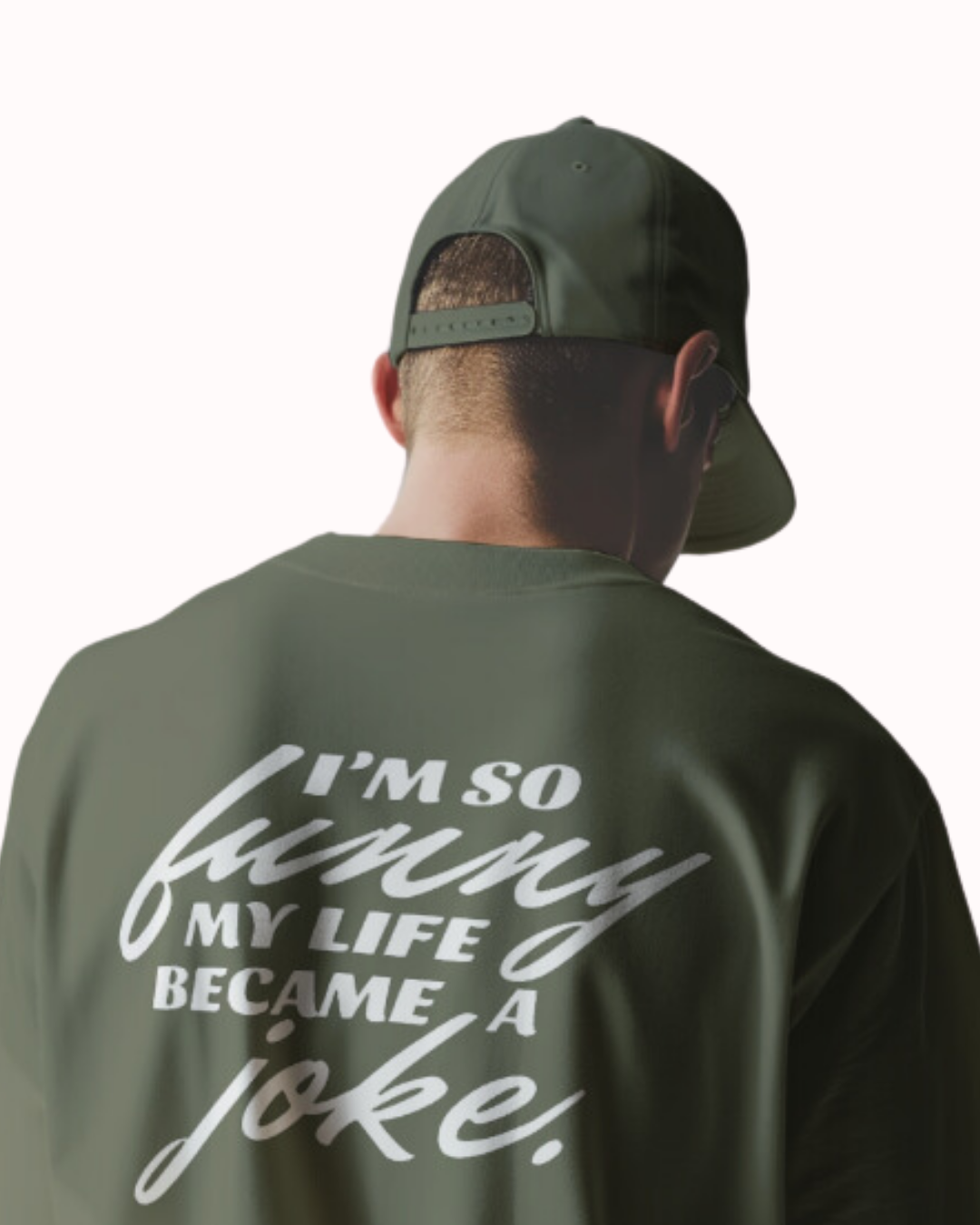 Back view of a military green T-Shirt featuring the phrase 'I'm so funny my life became a joke' on the back. Perfect for fans of funny merchandise, bold humor, and witty sarcasm.