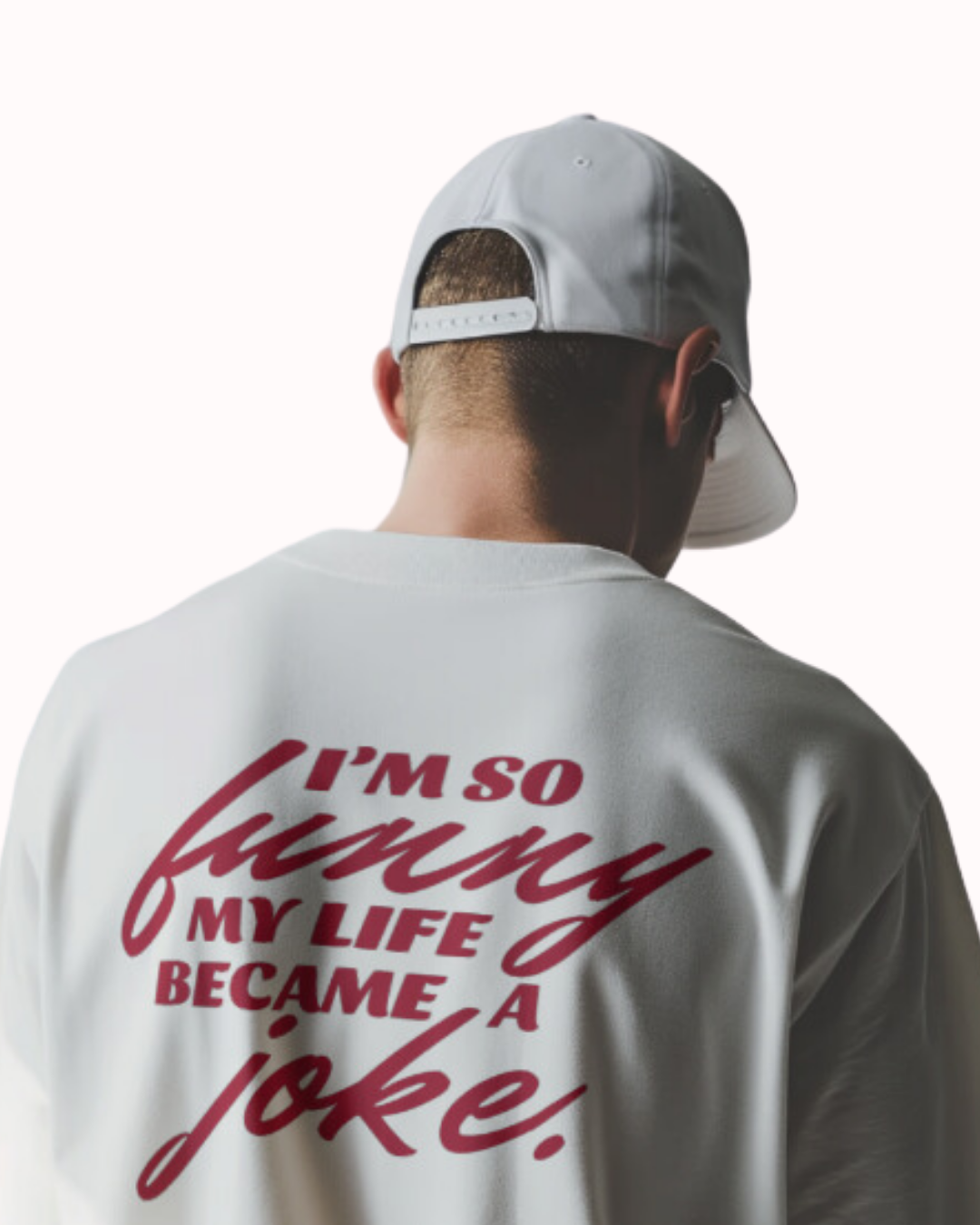 Back view of a white T-Shirt featuring the phrase 'I'm so funny my life became a joke' on the back. Perfect for fans of funny merchandise, bold humor, and witty sarcasm.