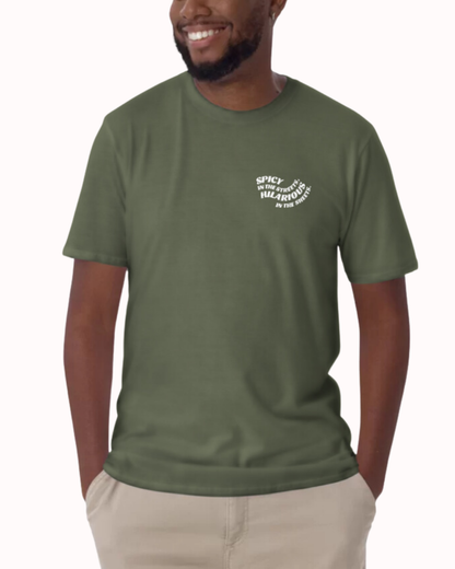 Front view of a military green T-Shirt worn by a smiling man, featuring the phrase 'Spicy in the streets, Hilarious in the sheets' on the chest and back. Perfect for fans of funny merchandise, bold humor, and witty sarcasm. 