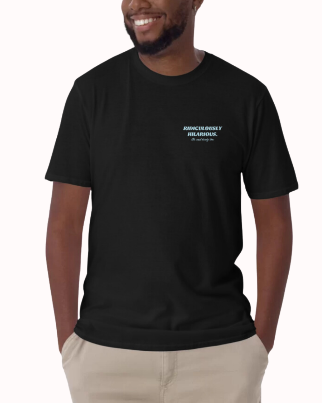 Front view of a black T-Shirt worn by a smiling man, featuring the phrase 'Ridiculously hilarious. Oh, and kinky too' on the chest and back. Perfect for fans of funny merchandise, bold humor, and witty sarcasm. 