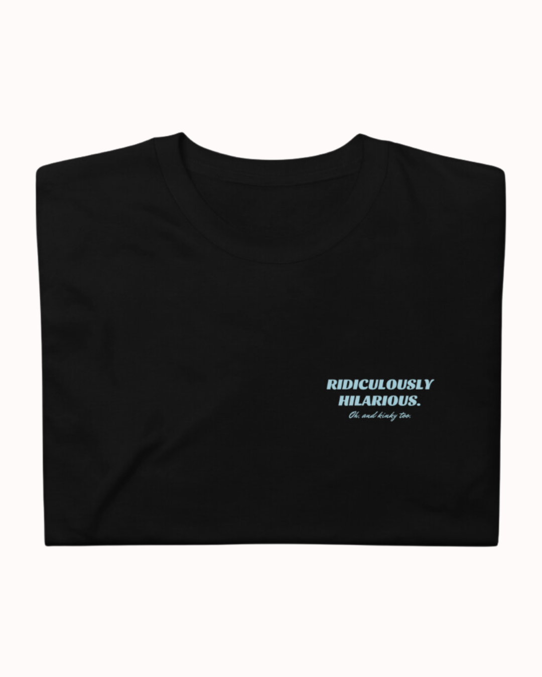 Folded black T-Shirt featuring the ironic phrase 'Ridiculously hilarious. Oh, and kinky too'. Perfect for fans of funny merchandise, bold humor, and witty sarcasm. 