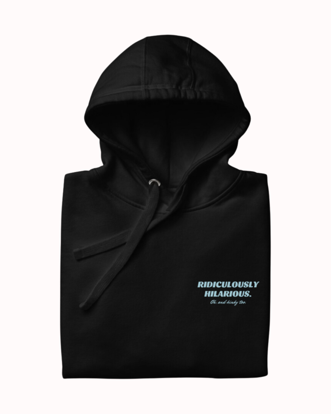 Folded black hoodie featuring the ironic phrase 'Ridiculously hilarious. Oh, and kinky too'. Perfect for fans of funny merchandise, bold humor, and witty sarcasm.