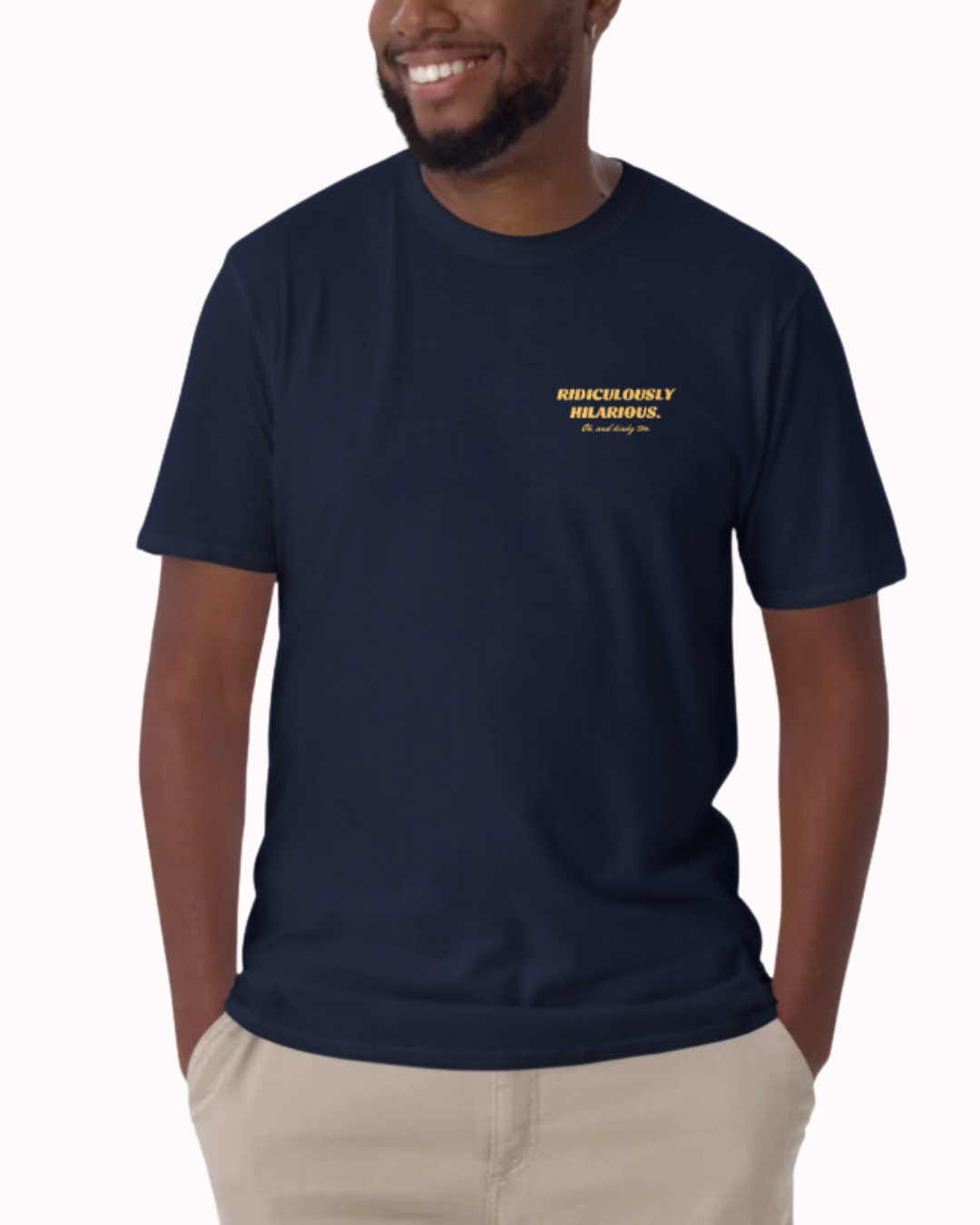 Front view of a navy T-Shirt worn by a smiling man, featuring the phrase 'Ridiculously hilarious. Oh, and kinky too' on the chest and back. Perfect for fans of funny merchandise, bold humor, and witty sarcasm. 