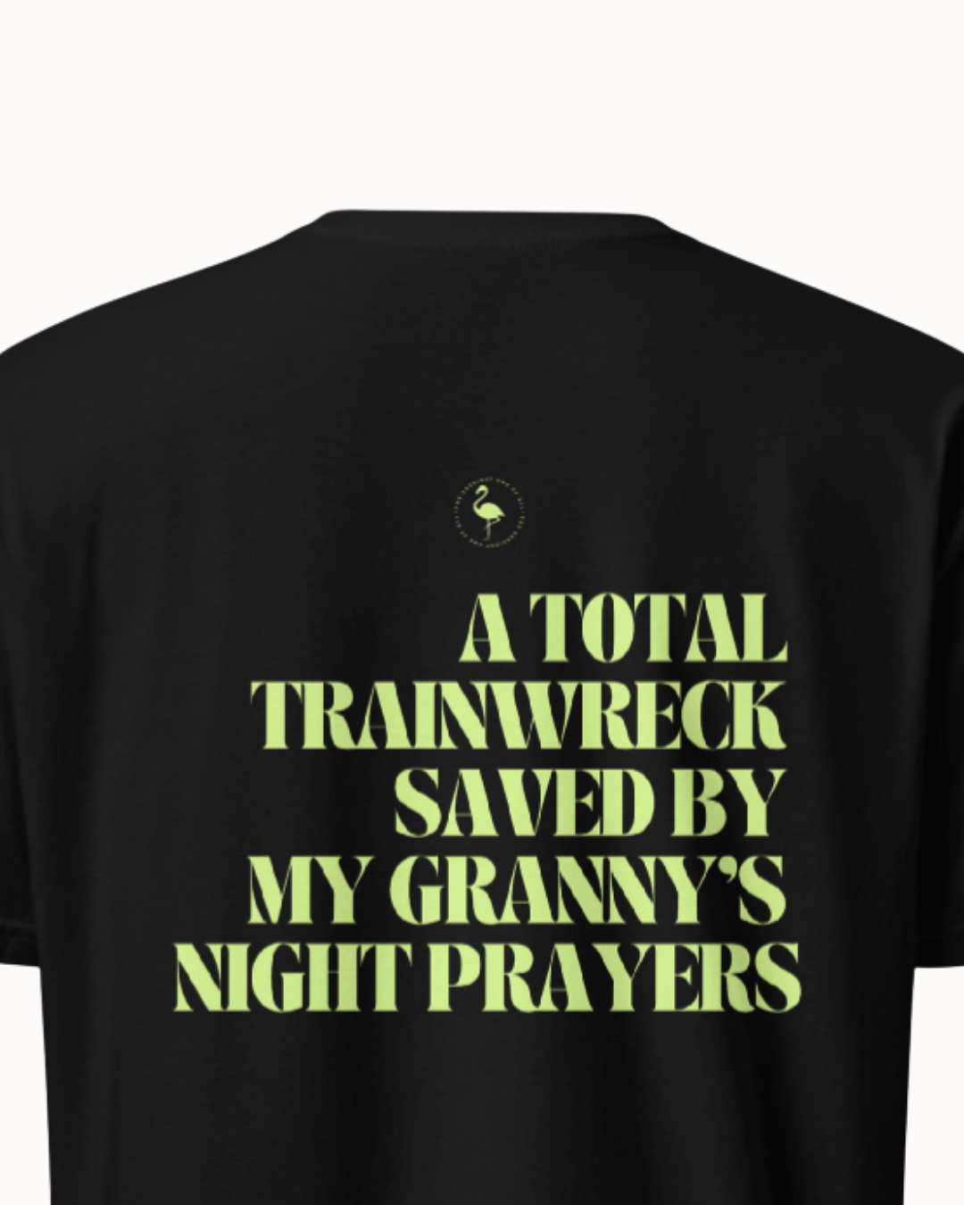 Back view of a Black t-shirt featuring the phrase "A total trainwreck saved my granny's night prayers" on the back. Perfect for fans of funny merchandise, bold humor, and witty sarcasm.