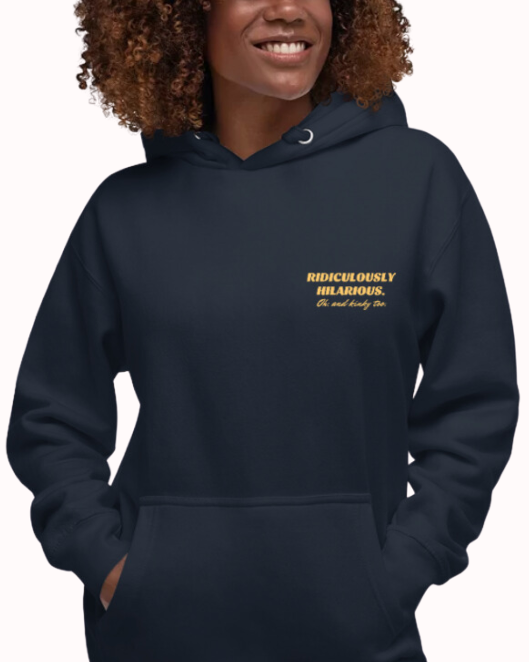 Front view of a navy blazer hoodie worn by a smiling woman, featuring the phrase 'Ridiculously hilarious. Oh, and kinky too' on the chest and back. Perfect for fans of funny merchandise, bold humor, and witty sarcasm.