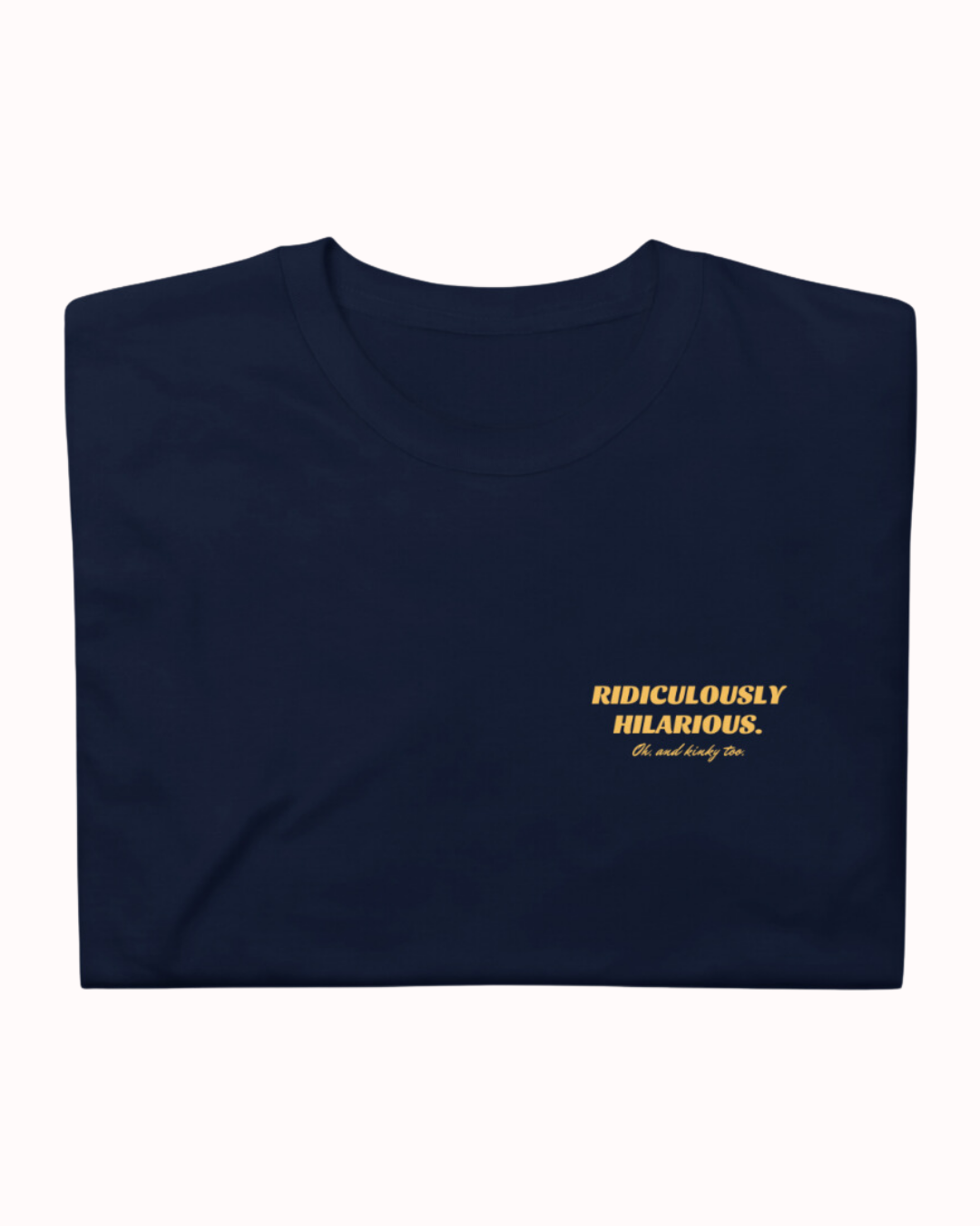 Folded navy T-Shirt featuring the ironic phrase 'Ridiculously hilarious. Oh, and kinky too'. Perfect for fans of funny merchandise, bold humor, and witty sarcasm. 