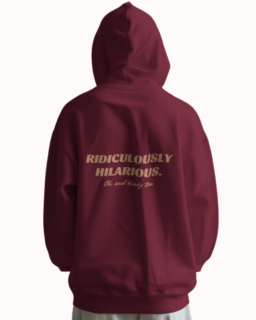 Back view of a maroon hoodie featuring the phrase 'Ridiculously hilarious. Oh, and kinky too' on the back. Perfect for fans of funny merchandise, bold humor, and witty sarcasm.