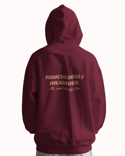  Back view of a maroon hoodie featuring the phrase 'Ridiculously hilarious. Oh, and kinky too' on the back. Perfect for fans of funny merchandise, bold humor, and witty sarcasm.