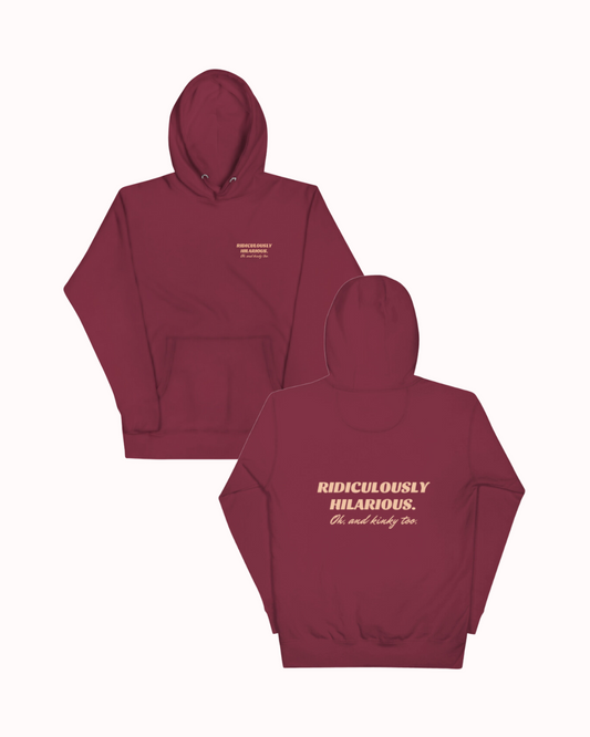  Back view of a maroon hoodie featuring the phrase 'Ridiculously hilarious. Oh, and kinky too' on the back. Perfect for fans of funny merchandise, bold humor, and witty sarcasm.
