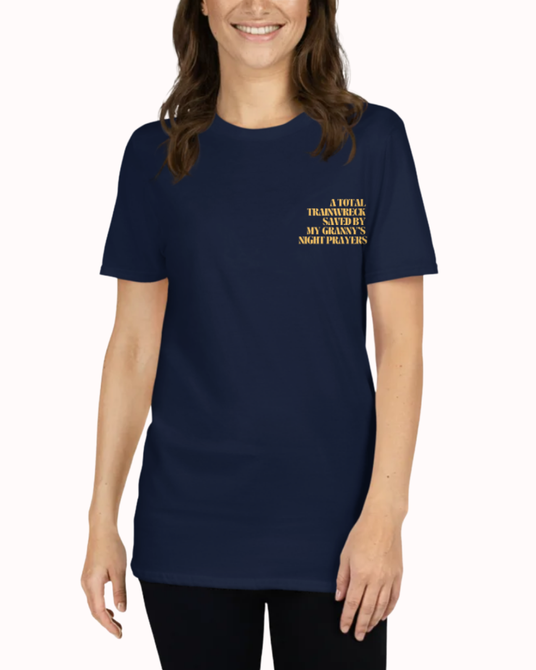 Front view of a Navy t-shirt worn by a smiling woman, featuring the phrase "A total trainwreck saved my granny's night prayers" on the chest and back. Perfect for fans of funny merchandise, bold humor, and witty sarcasm.