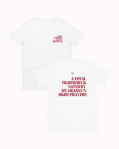 Front and back view of a White t-shirt featuring the phrase "A total trainwreck saved my granny's night prayers" on the back. Perfect for fans of funny merchandise, bold humor, and witty sarcasm.