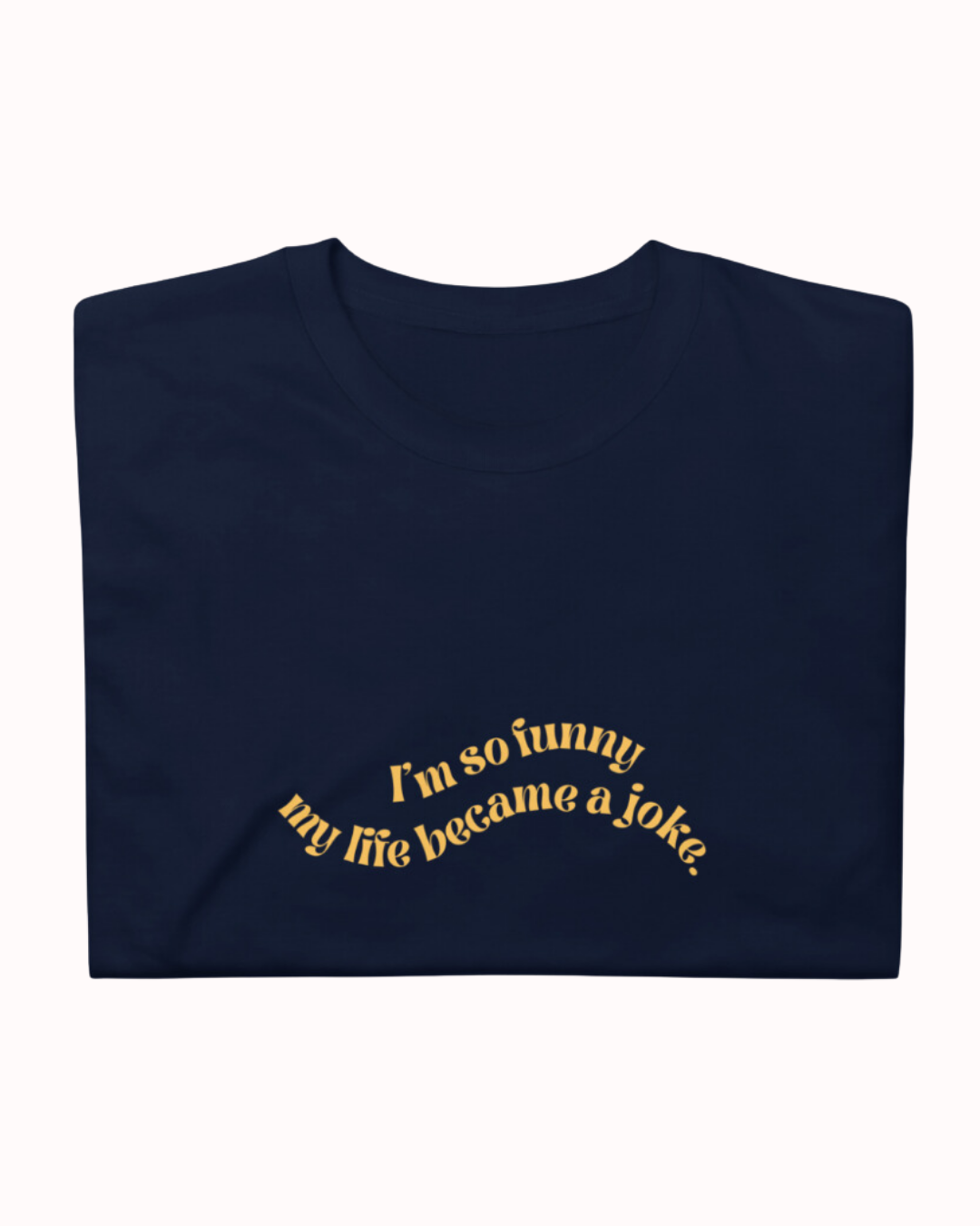 Folded navy T-Shirt featuring the ironic phrase 'I'm so funny my life became a joke'. Perfect for fans of funny merchandise, bold humor, and witty sarcasm. 