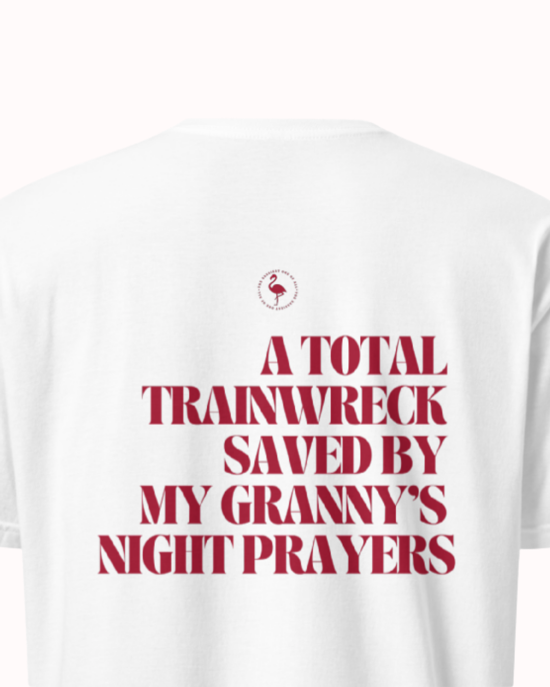 Back view of a White t-shirt featuring the phrase "A total trainwreck saved my granny's night prayers" on the back. Perfect for fans of funny merchandise, bold humor, and witty sarcasm.