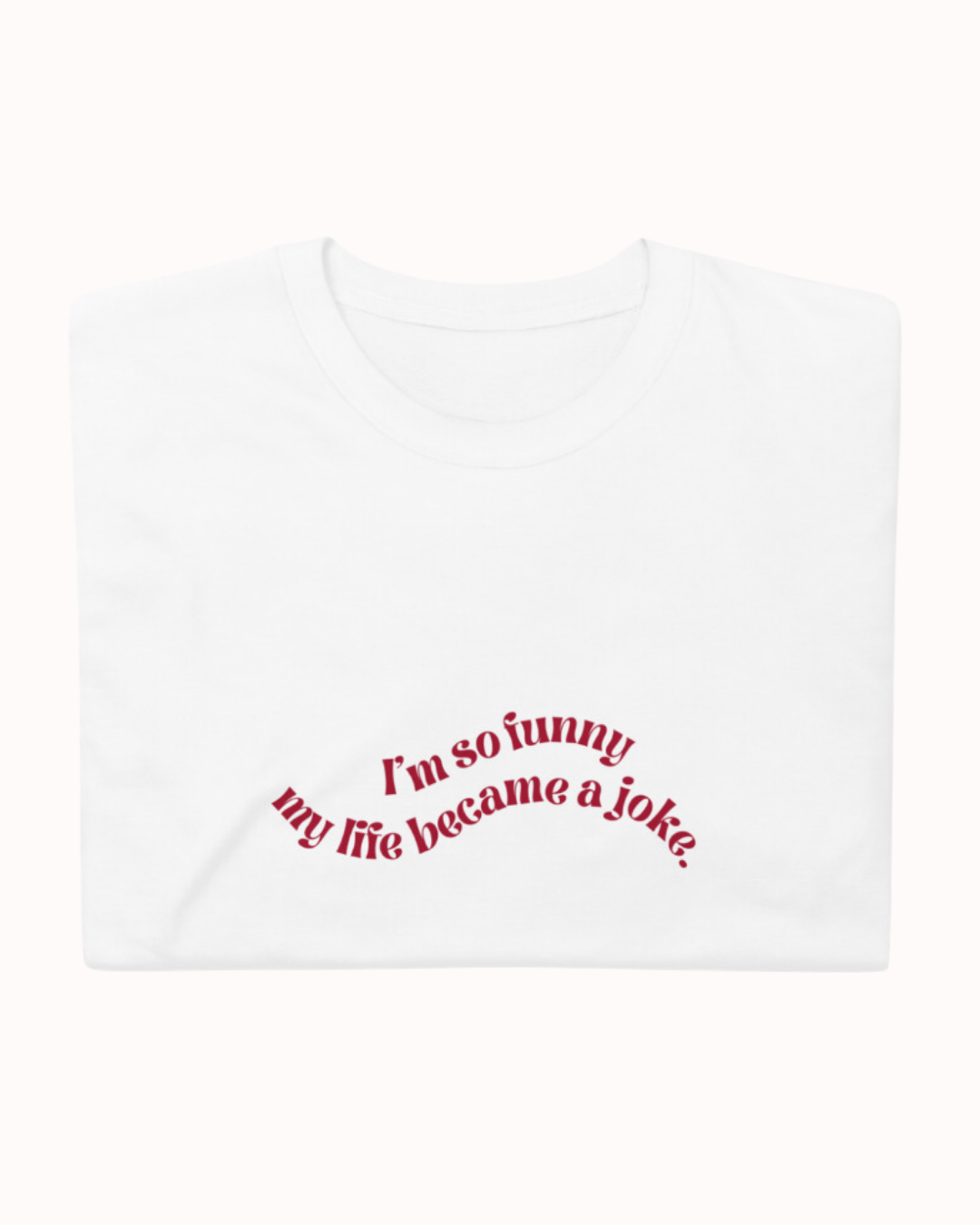 Folded white T-Shirt featuring the ironic phrase 'I'm so funny my life became a joke'. Perfect for fans of funny merchandise, bold humor, and witty sarcasm. 