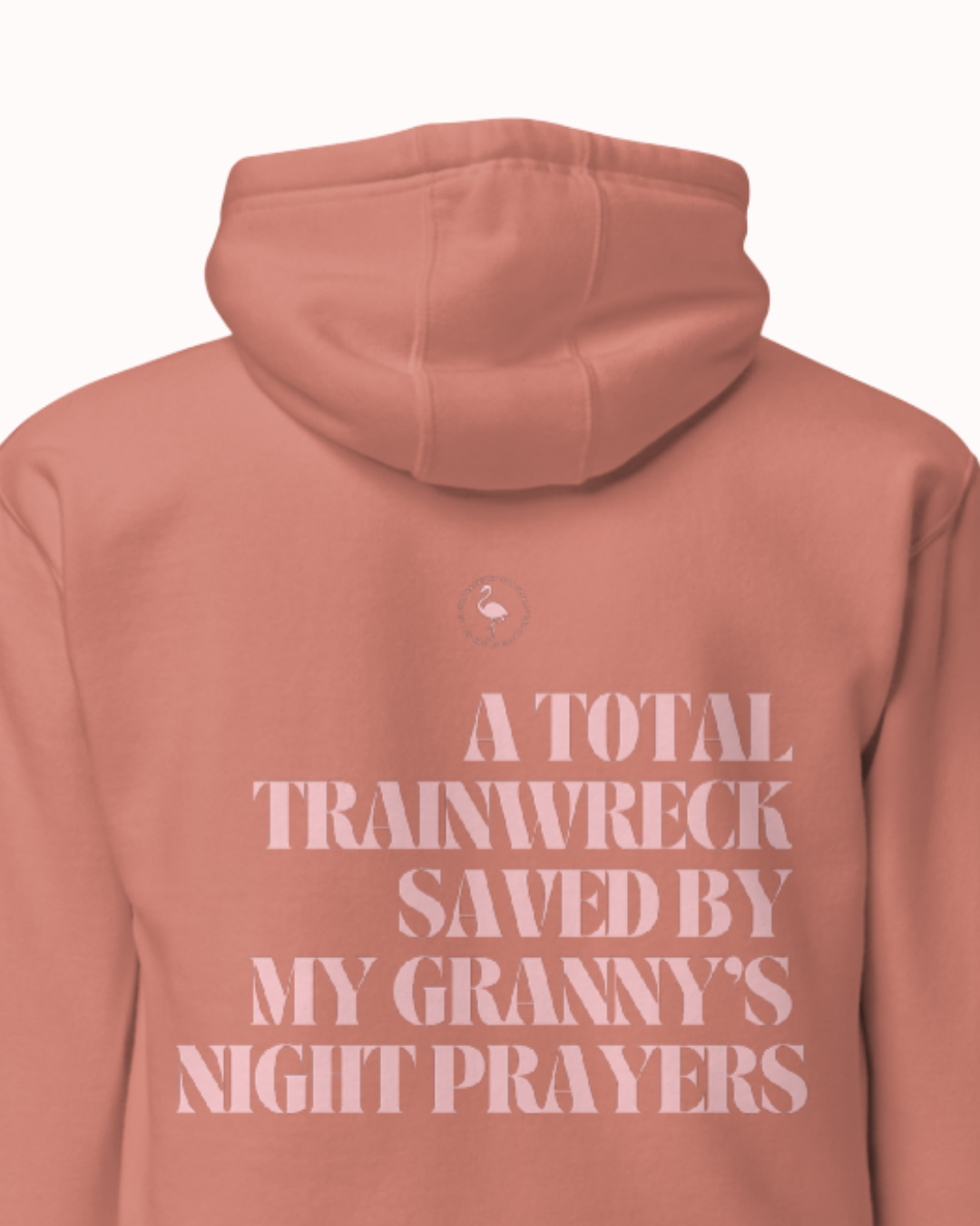 Folded Dusty Rose hoodie featuring the ironic phrase "A total trainwreck saved my granny's night prayers". Perfect for fans of funny merchandise, bold humor, and witty sarcasm.