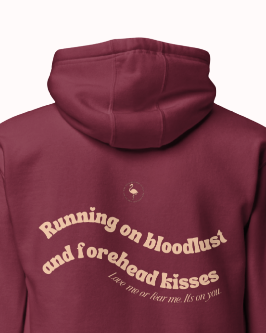 Back view of a Maroon hoodie featuring the phrase "Running on bloodlust and forehead kisses" on the back. Perfect for fans of funny merchandise, bold humor, and witty sarcasm.