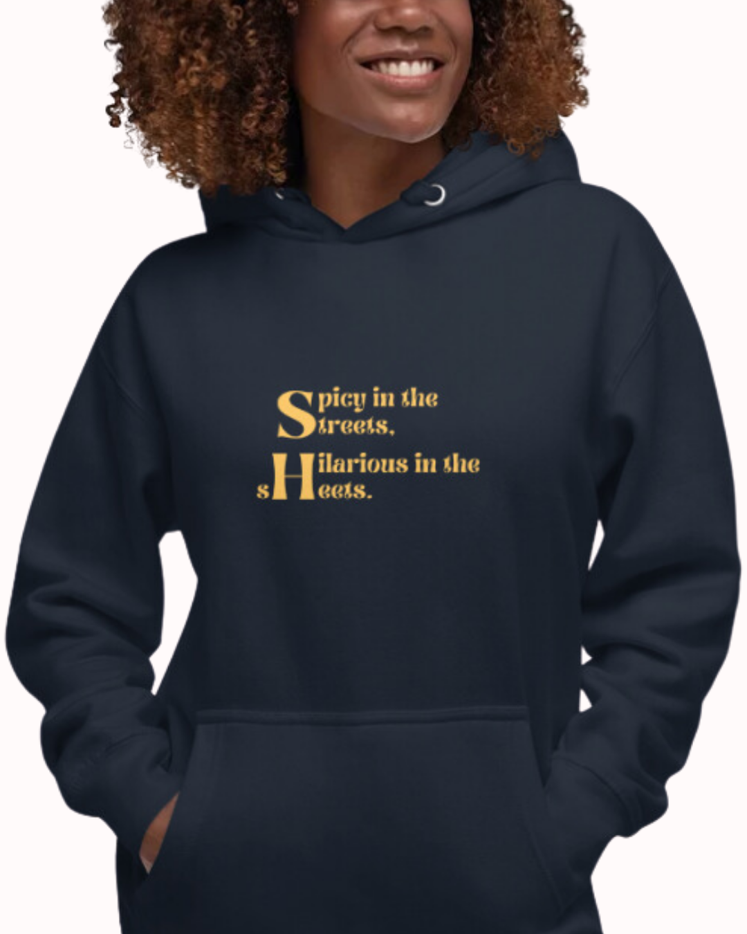 Front view of a navy blazer hoodie worn by a smiling woman, featuring the phrase 'Spicy in the streets, Hilarious in the sheets' on the chest. Perfect for fans of funny merchandise, bold humor, and witty sarcasm.