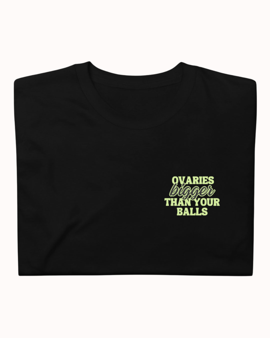 Folded Black t-shirt featuring the ironic phrase "Ovaries bigger than your balls". Perfect for fans of funny merchandise, bold humor, and witty sarcasm.