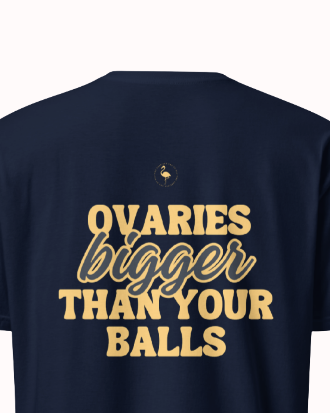 Back view of a Navy t-shirt featuring the phrase "Ovaries bigger than your balls" on the back. Perfect for fans of funny merchandise, bold humor, and witty sarcasm.